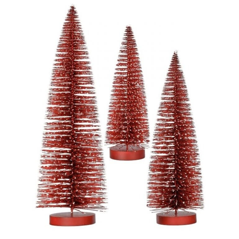 Red artificial bristle tree ornament with white snow-tipped branches.