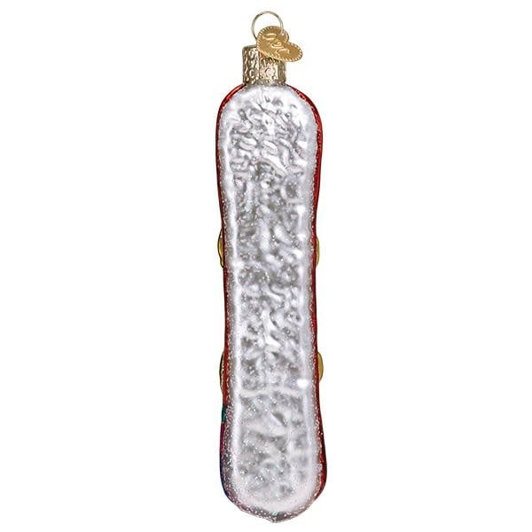 Snowboard ornament with blue base, white graphic board shape, silver bindings, red tip.
