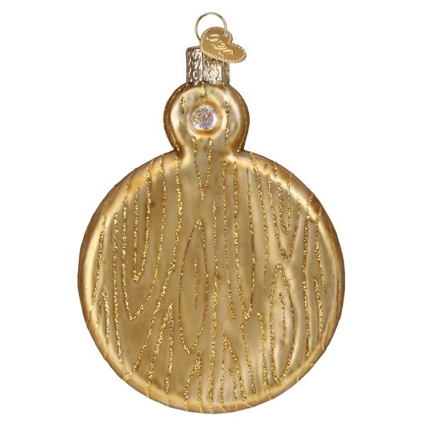 Gold glass charcuterie board ornament with glittery wood grain pattern and a heart-shaped tag.