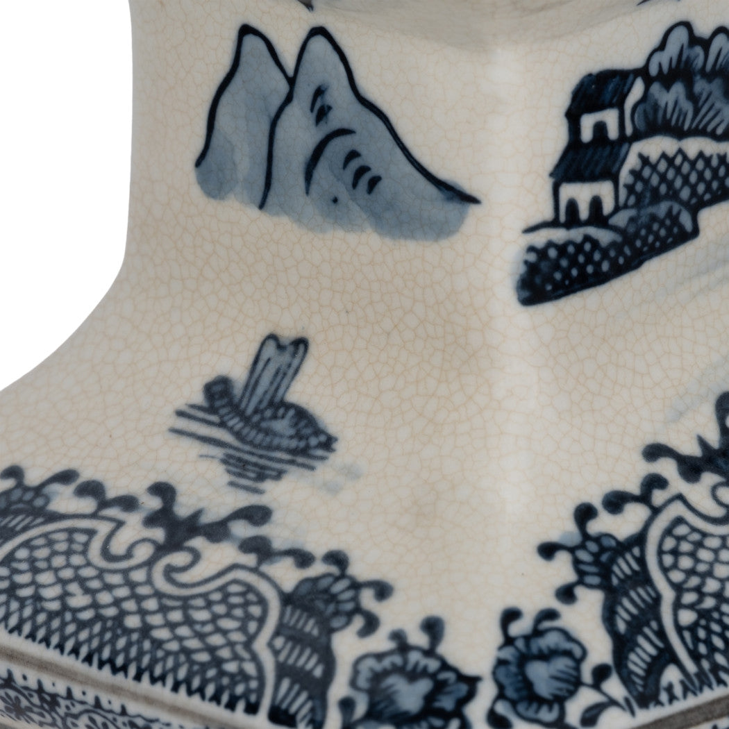 Close-up of blue chinoiserie landscape patterns on a crackle-glaze ceramic temple vase.