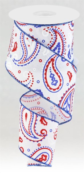White, red, and royal blue paisley print fabric swatch on a white background.