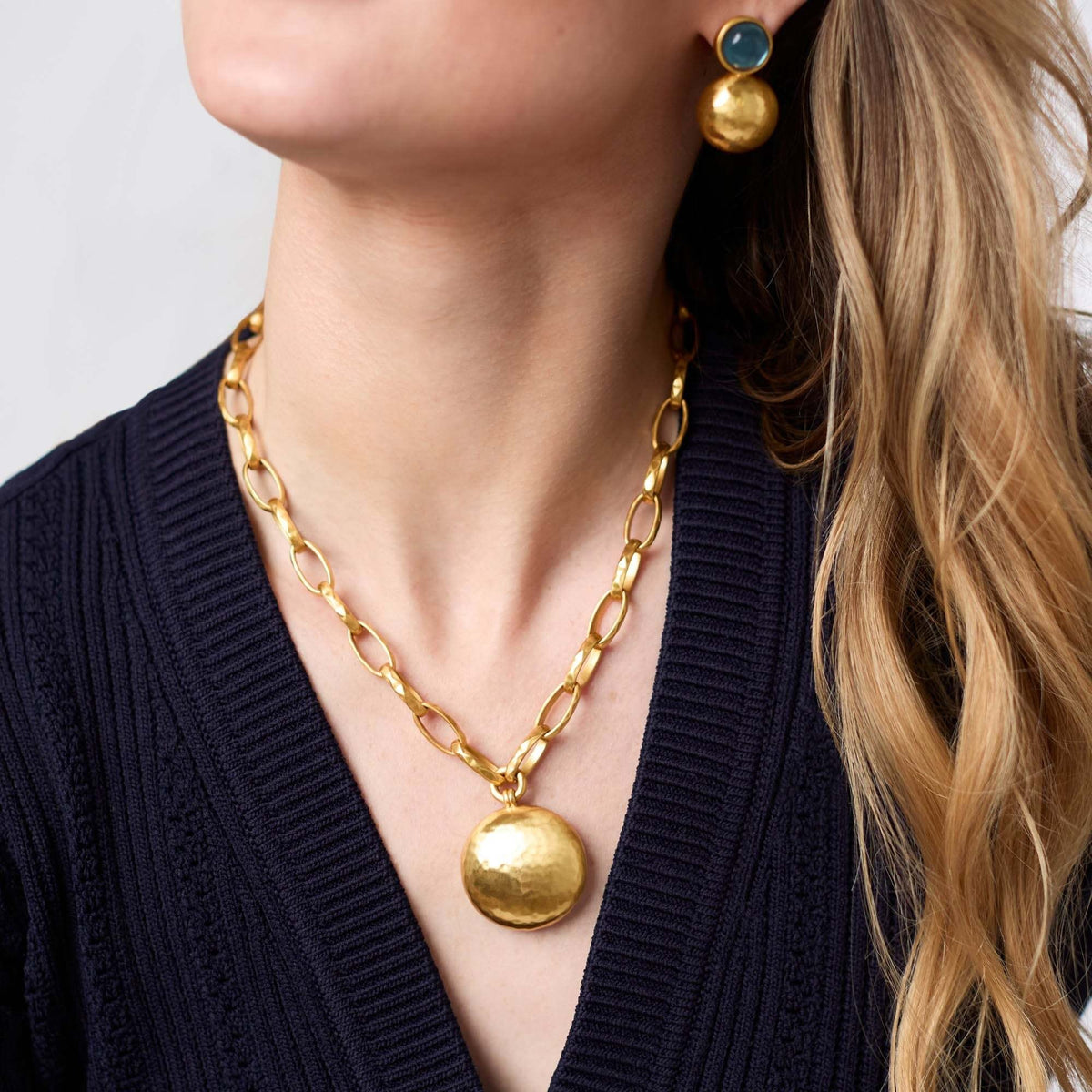 Gold plated Solara necklace with a sleek pendant on an adjustable 20-inch chain.