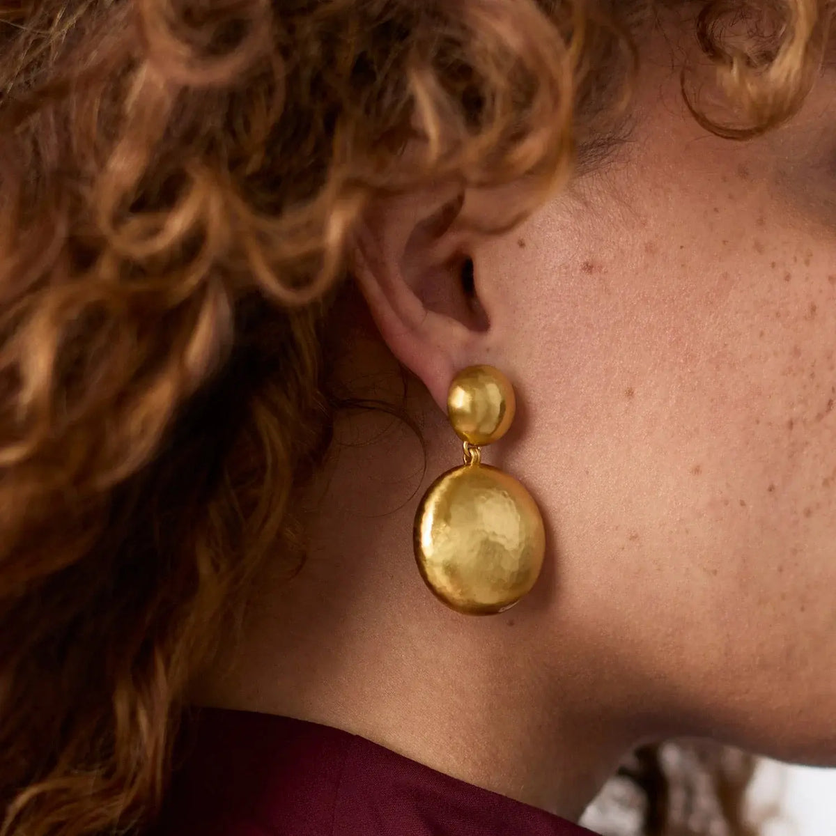Gold-plated Solara statement earring with a bold geometric silhouette.