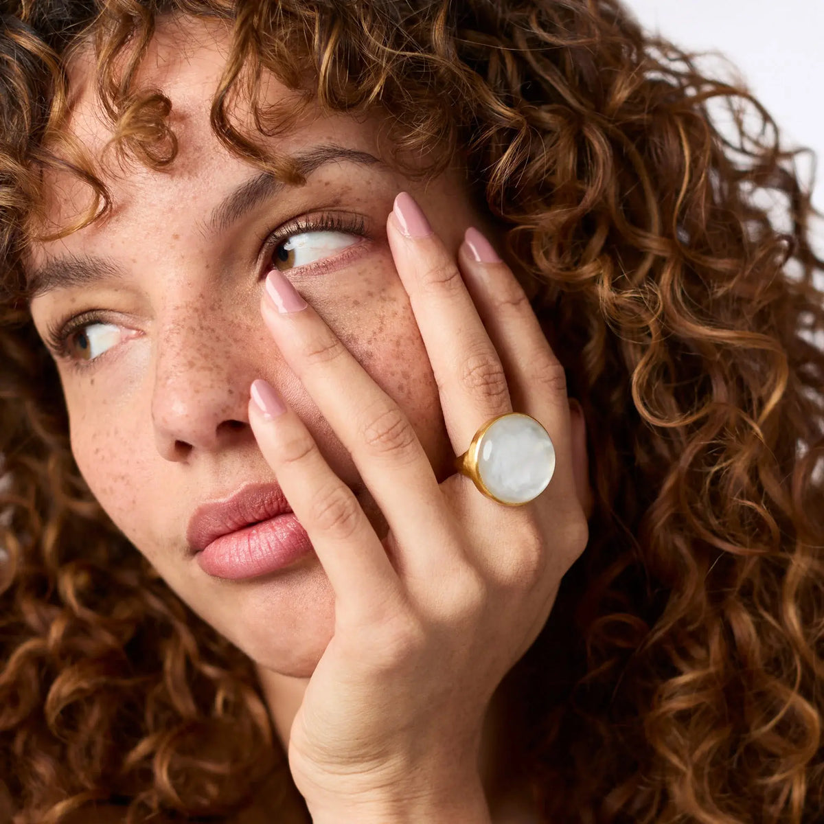 Solara Statement Ring in gold-plated metal with a clear imported glass stone.