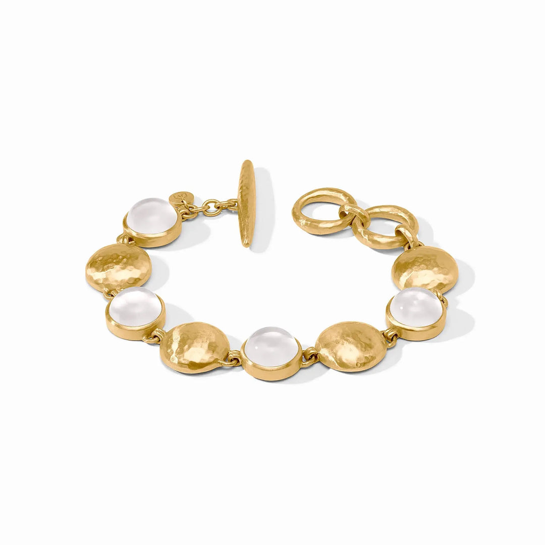 Adjustable gold Solara Stone bracelet with iridescent clear crystals on a toggle clasp.