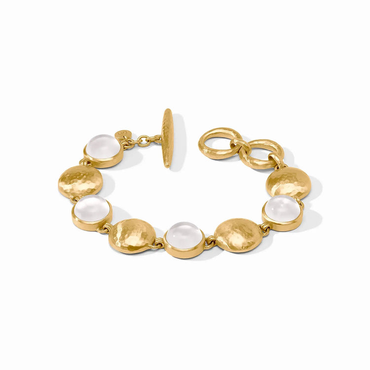 Adjustable gold Solara Stone bracelet with iridescent clear crystals on a toggle clasp.