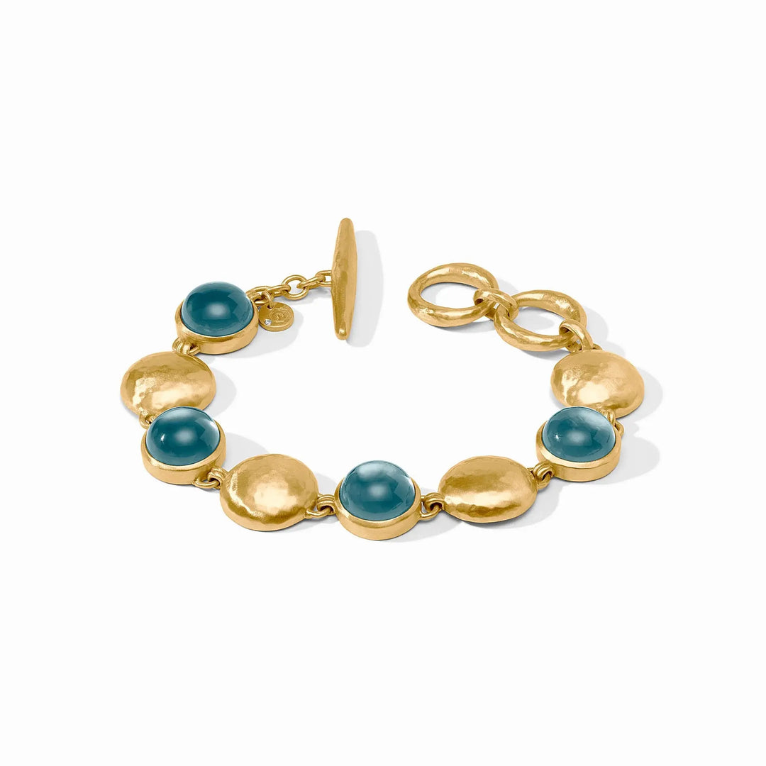 Gold adjustable stone bracelet with iridescent Montana blue accents.