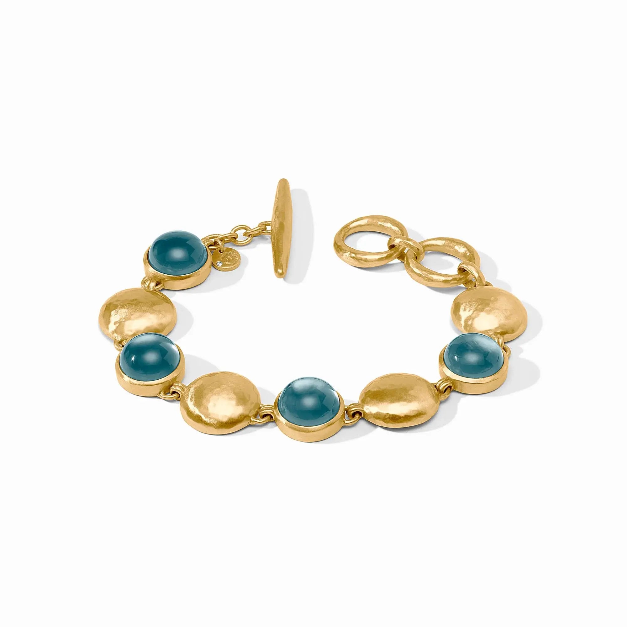 Gold adjustable stone bracelet with iridescent Montana blue accents.