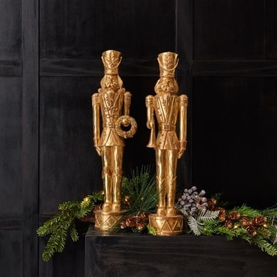 Twenty-inch tall soldier figurine made from resin with a dark uniform standing on a rectangular base.