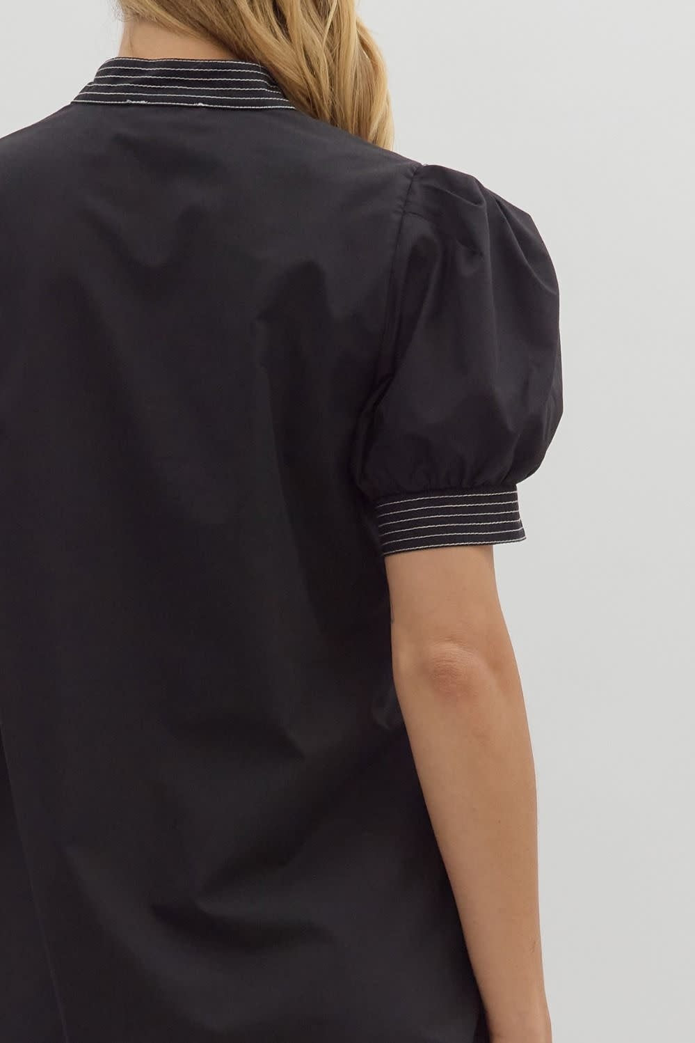 Solid mini dress with puff sleeves, contrast stitching at neckband and hem.
