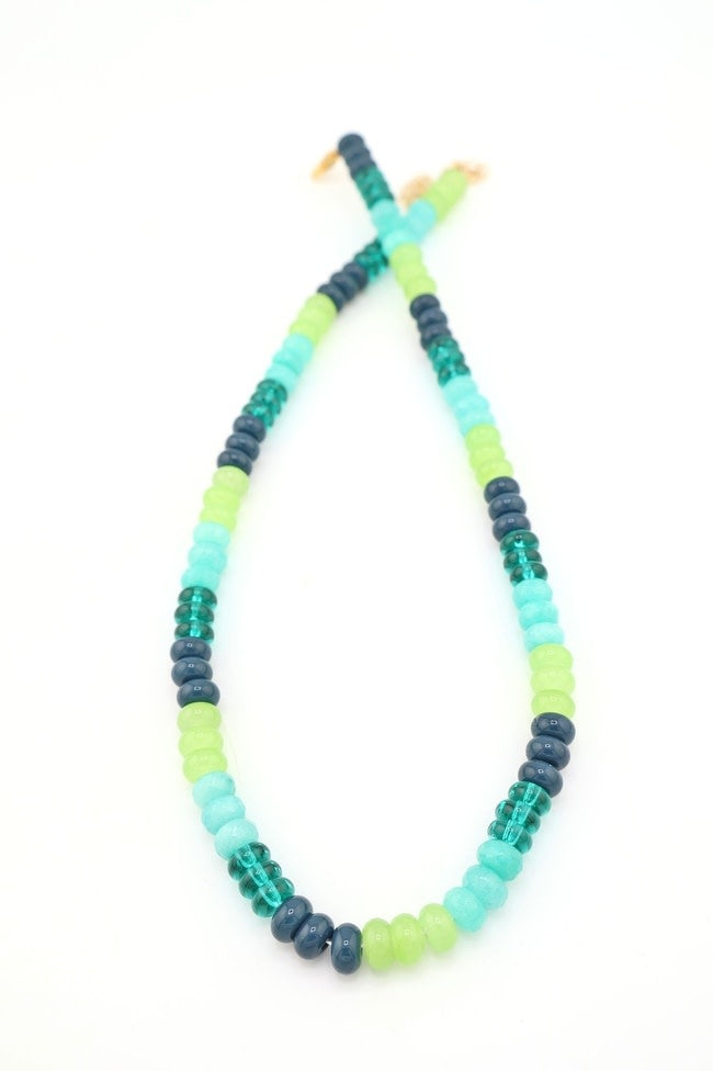 Adjustable necklace with blue-green dyed jade colorblock beads on a silver chain.