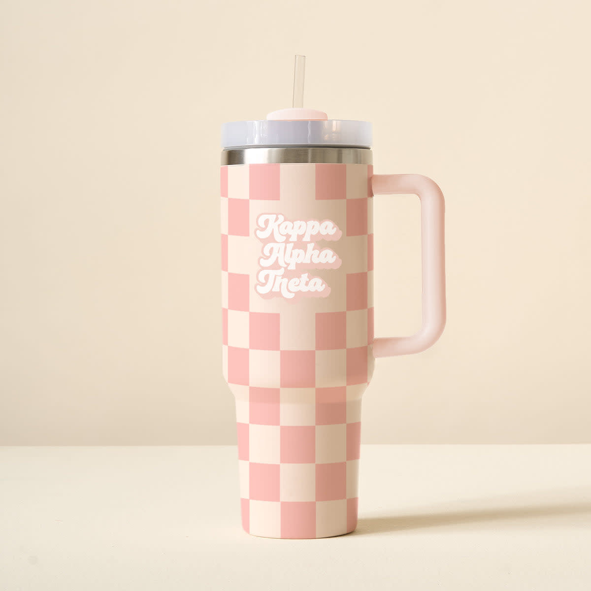 Black sorority tumbler with check pattern, reusable straw lid, handle, and car cup holder compatibility.