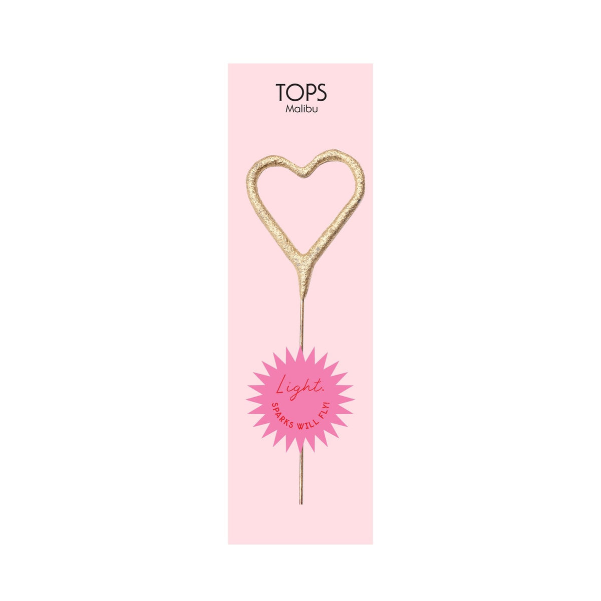 Mini gold heart-shaped sparkler on a pink background