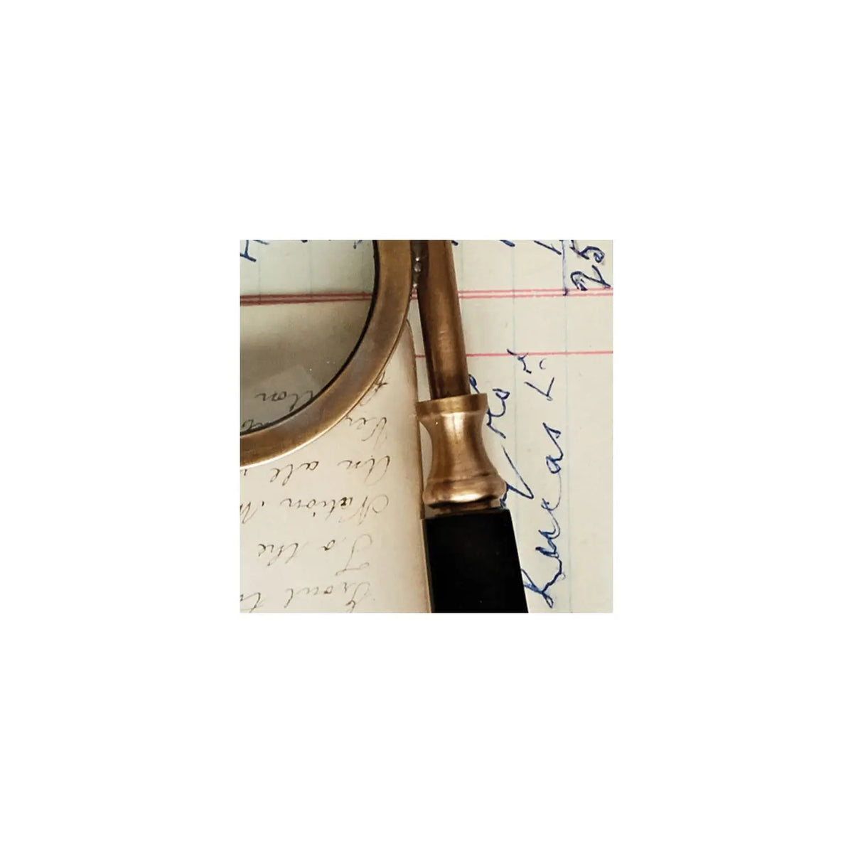 Antique-style magnifying glass spectacles with a circular lens on a decorative stand.
