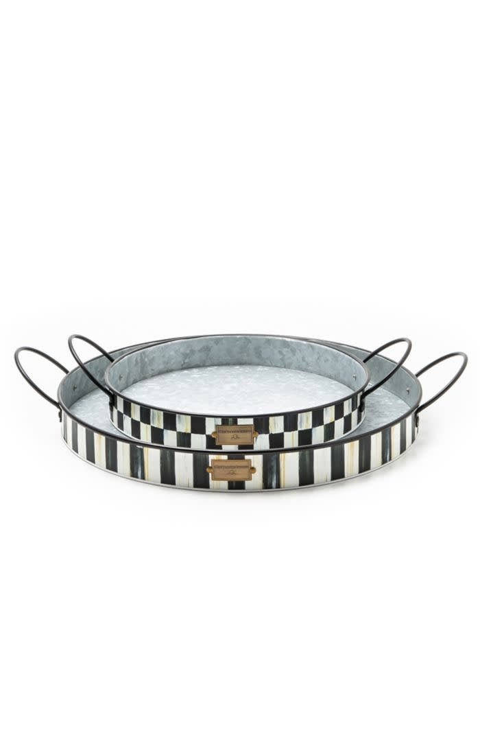 Small galvanized metal serving tray with a rustic circular shape.