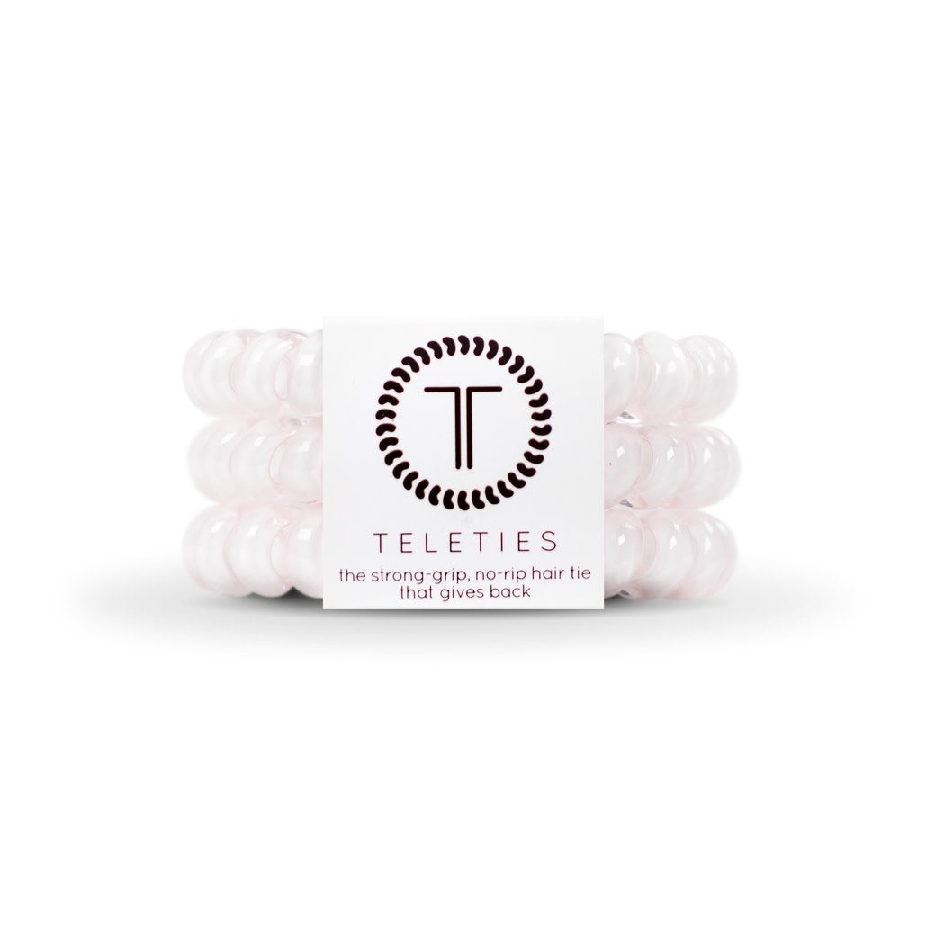 Three large rose water pink spiral hair coils with a bracelet-style grip.