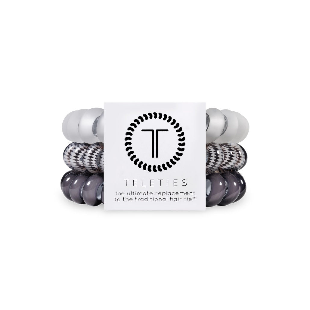 Three silver spiral hair coils with a flame-like texture designed as large elastic ties.