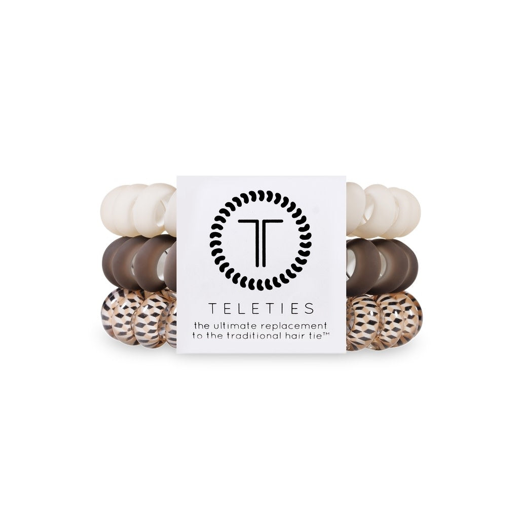 Three large toasted spiral hair coils with a bracelet-style grip.