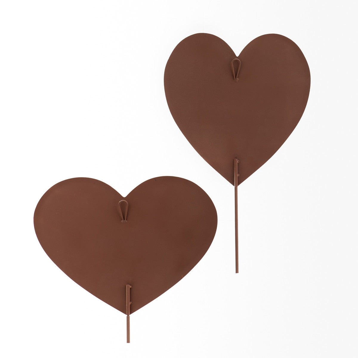 Two brown metal heart stakes with a loop for hanging.