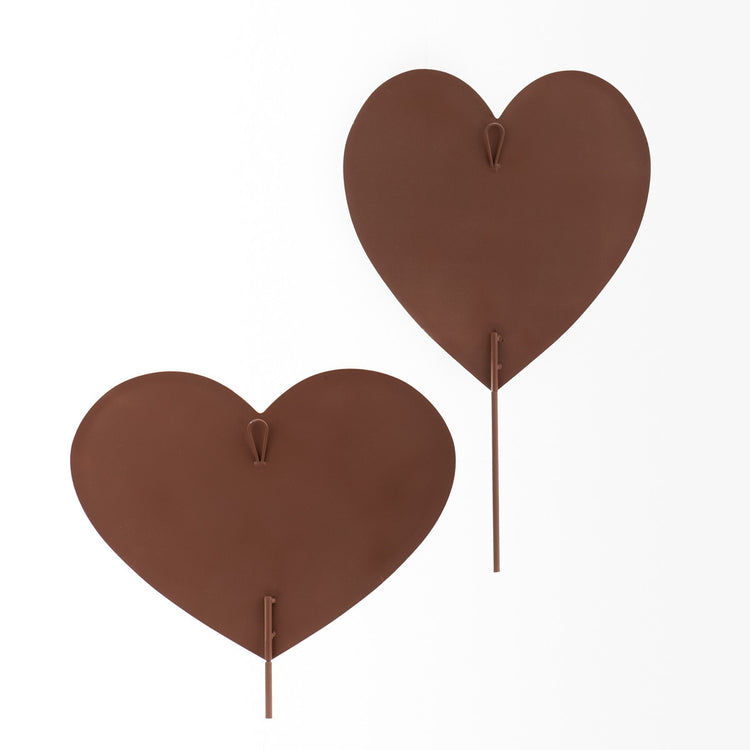 Two brown metal heart stakes with a loop for hanging.