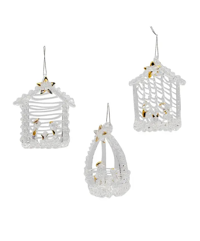 Three spun glass nativity ornaments featuring Jesus, Mary, Joseph in a stable with gold detailing and a star.