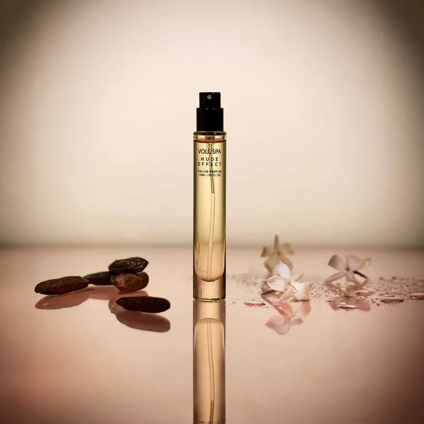Bottle of Nude Effect Eau De Parfum with warm beige liquid visible through clear glass.