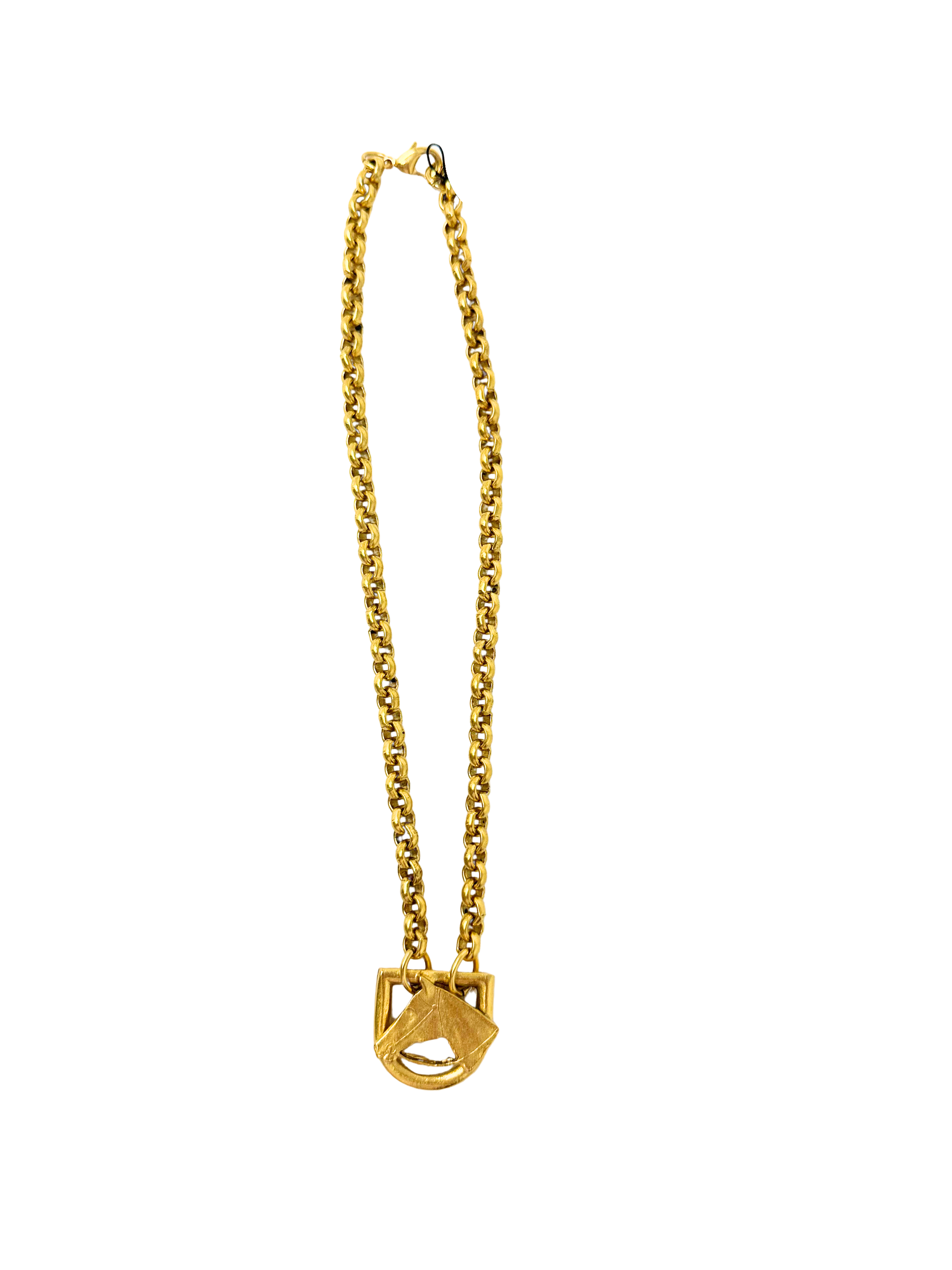 Gold chain necklace with a sculpted horse head motif pendant on a white background.