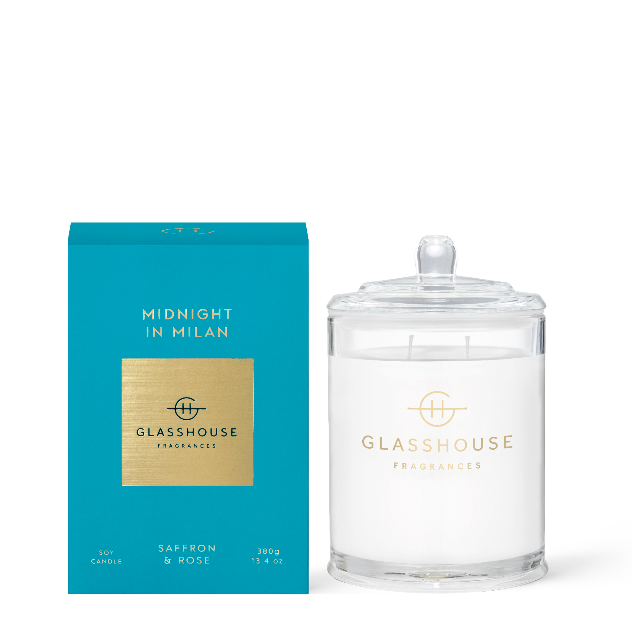 Midnight in Milan candle with a dark glass jar containing warm amber wax.