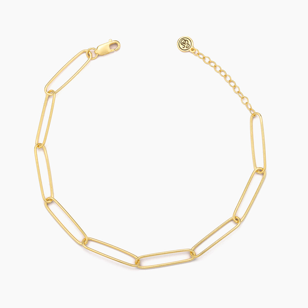 Paperclip chain bracelet in gold-plated sterling silver with a lobster clasp closure.