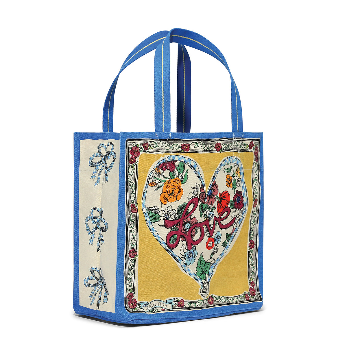 Canvas tote bag with blue trim, featuring a floral heart design and 'Love' script on a yellow panel.