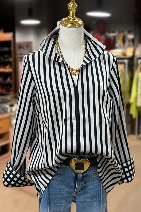 Merly Rayon blouse with contrast roll sleeves in a printed pattern.