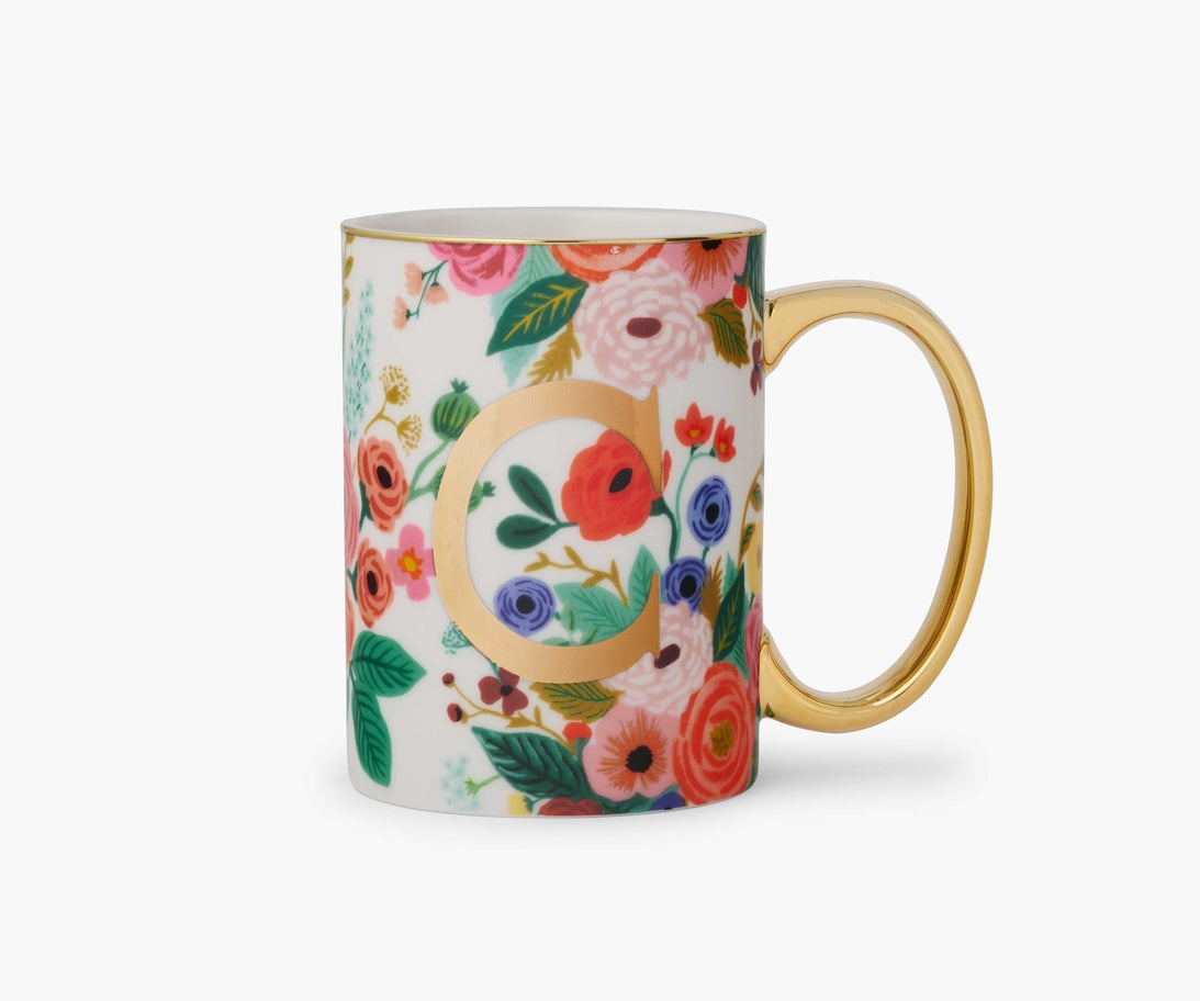 Garden Party porcelain mug with colorful floral pattern, gold handle, and gold monogram letter C.