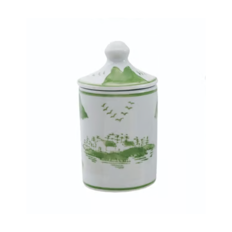 Hand-stamped white stoneware spice jar with green landscape scene and lid.