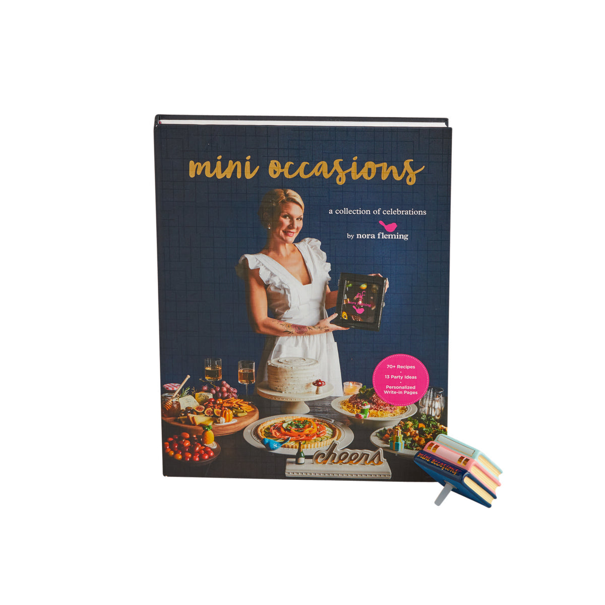 Mini Occasions book by Nora Fleming featuring a woman with a cake and party food on the cover.