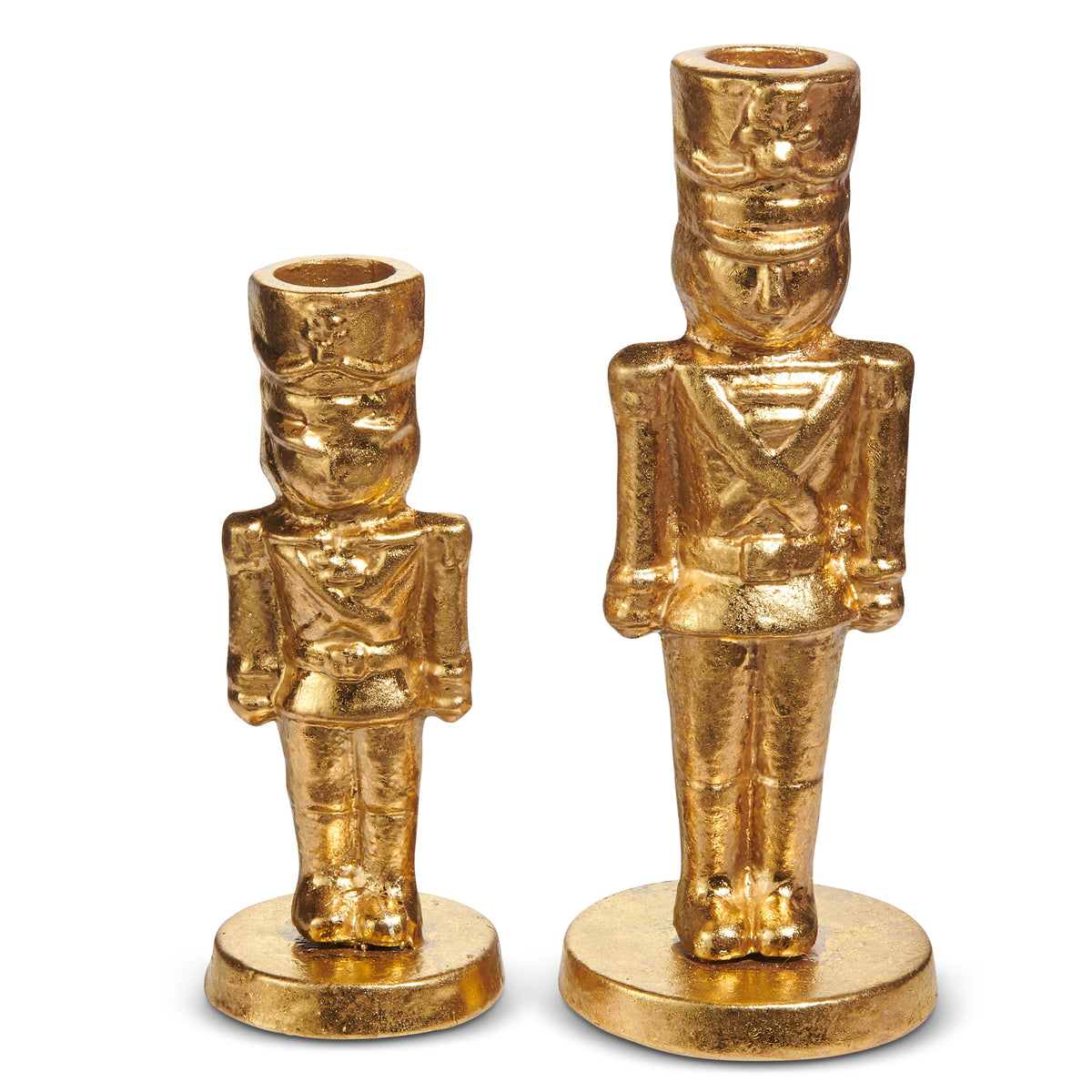 Two gold iron nutcracker-shaped candlesticks in different sizes on a white background.