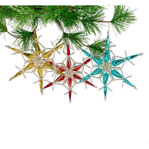 Shiny red Razzke Dazzlers ornament with gold accents hanging on a holiday tree branch.