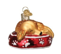 Golden Retriever dog ornament with sleepy expression in gold metallic finish