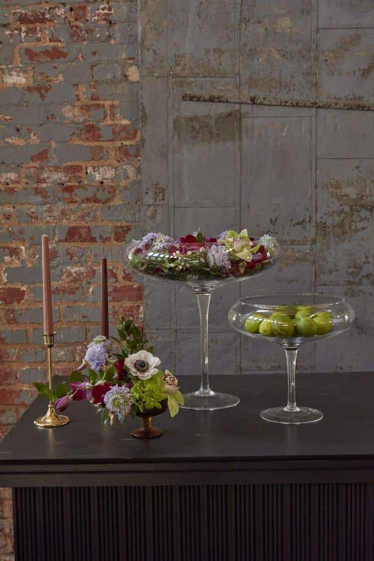 Small clear glass Belvedere vase with a square silhouette measuring 11 inches tall and an opening size of 9.5 inches.