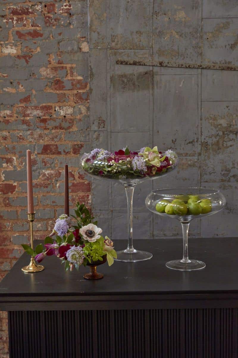 Small clear glass Belvedere vase with a square silhouette measuring 11 inches tall and an opening size of 9.5 inches.