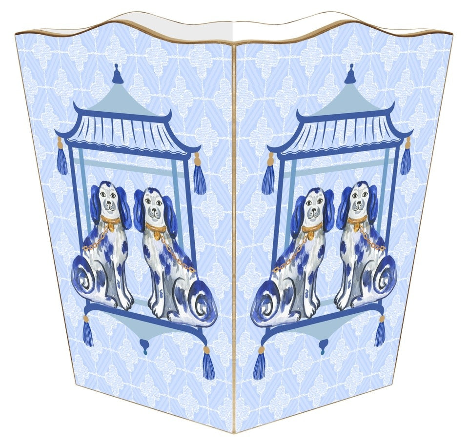 Scalloped-top wastepaper basket with gold-painted edges on a blue background.