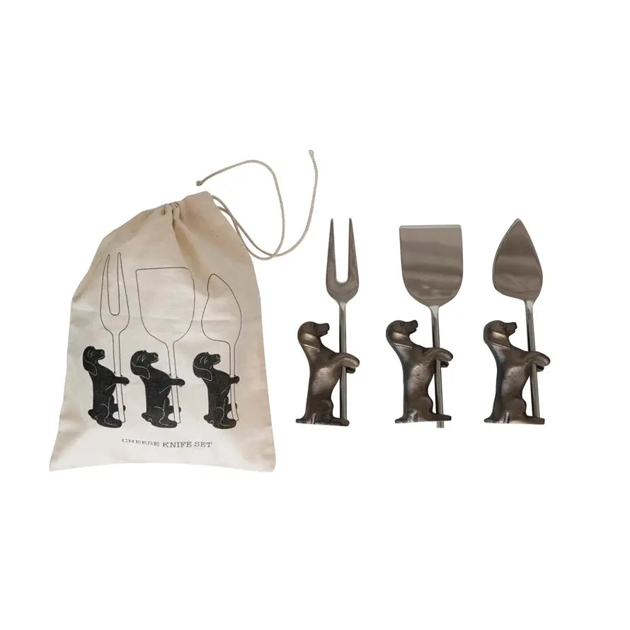 Stainless steel cheese serving knives with aluminum dog stands on a tray