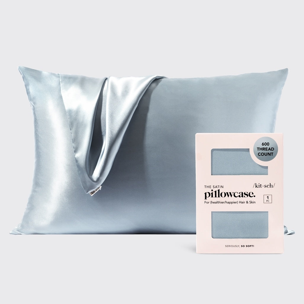 Haze blue satin pillowcase with smooth texture designed to reduce frizz and prevent facial creases.