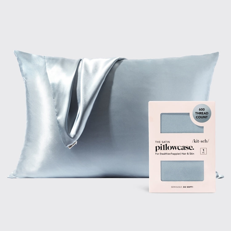 Haze blue satin pillowcase with smooth texture designed to reduce frizz and prevent facial creases.