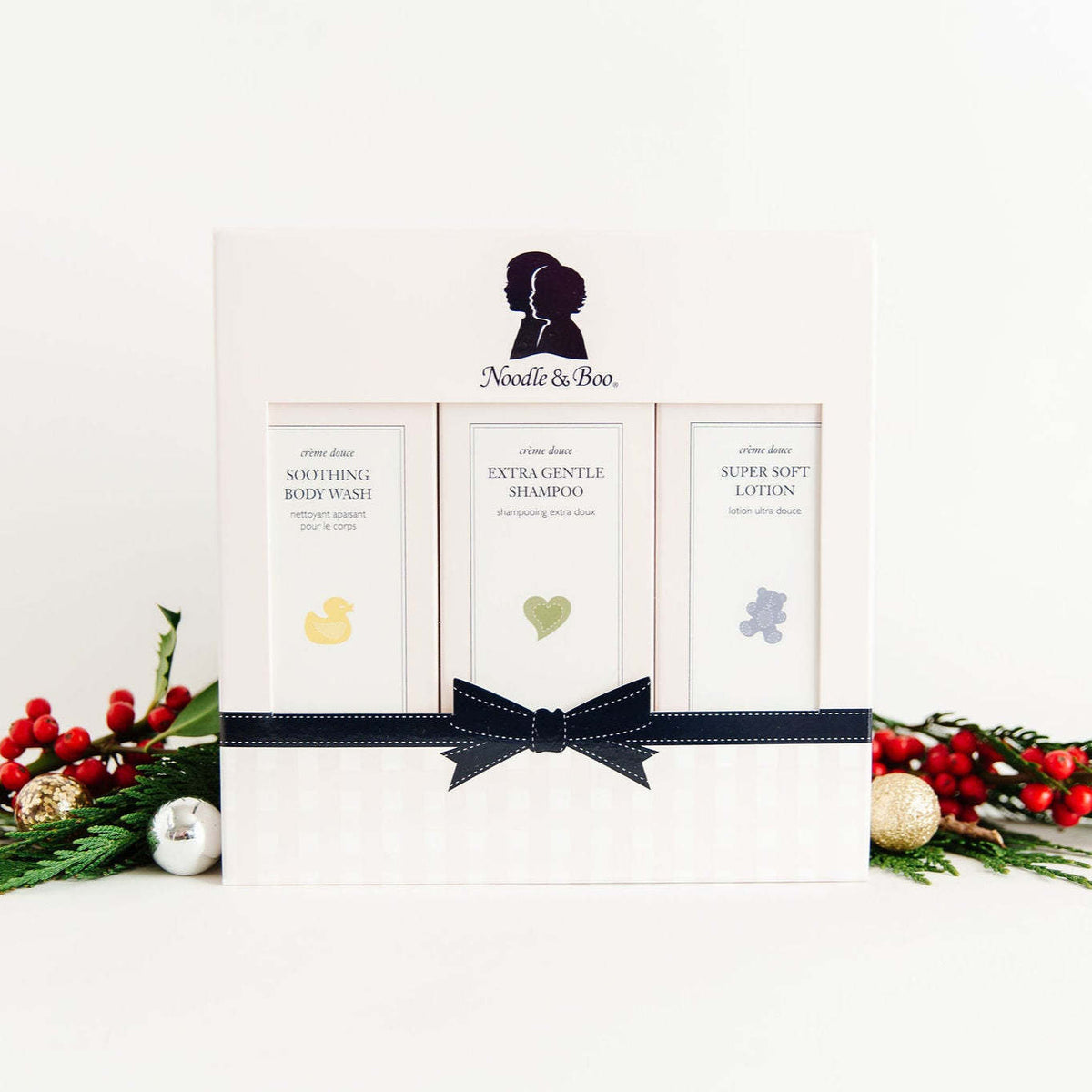 Starter Baby Gift Set box with gentle shampoo, body wash, and lotion bottles in soft pastel colors.