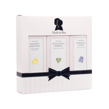 Starter Baby Gift Set with gentle shampoo, body wash, and lotion bottles in neutral tones.