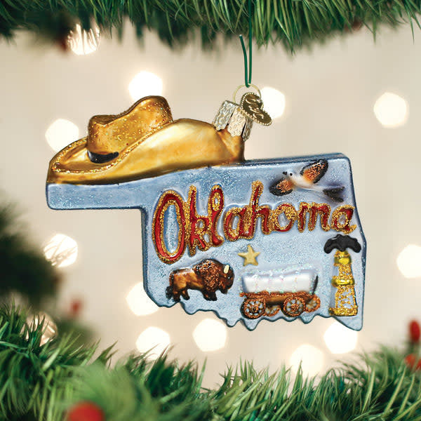 Mouth-blown glass ornament shaped like the State of Oklahoma with silver accents.