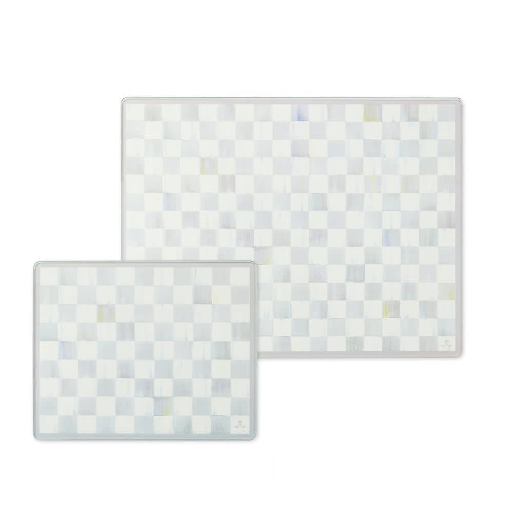 Set of two tempered glass cutting boards with Sterling Check geometric patterns in small and large sizes.