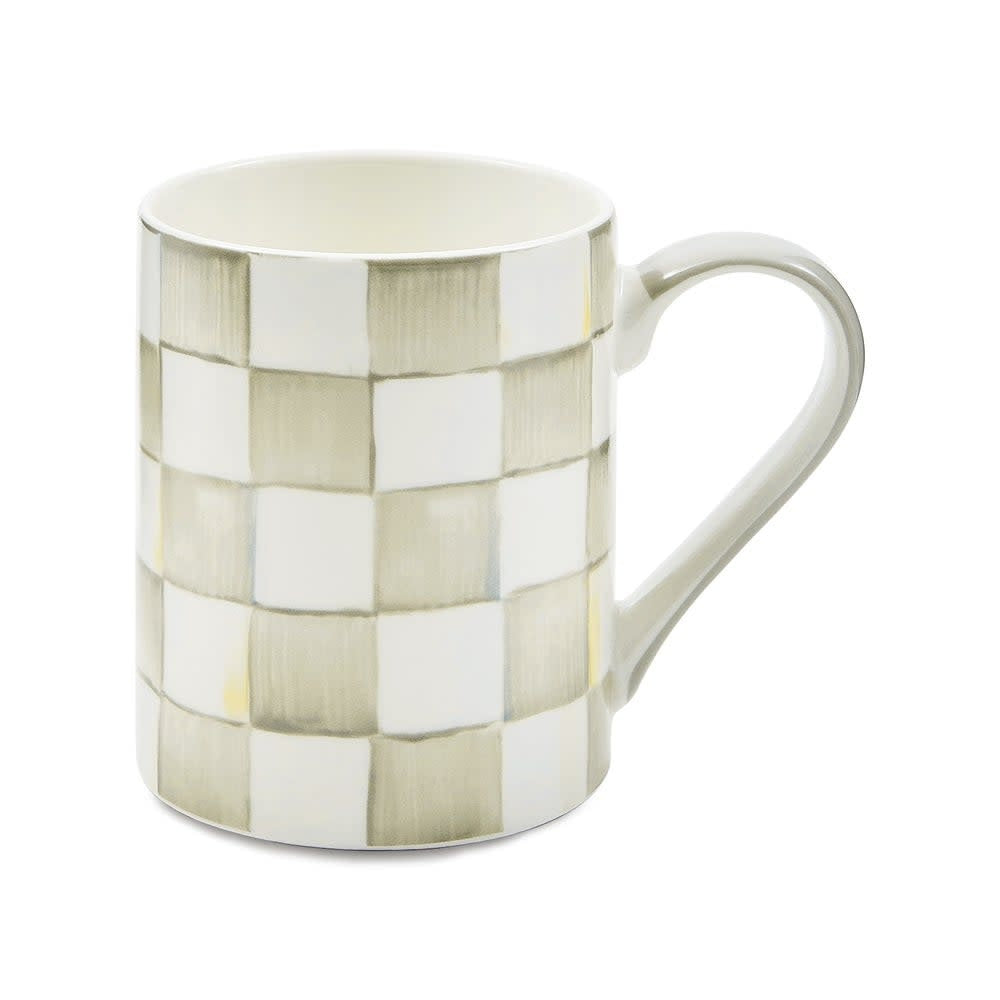 Handmade checkered porcelain coffee mug with a cylindrical shape.
