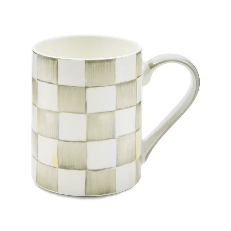 Handmade checkered porcelain coffee mug with a cylindrical shape.