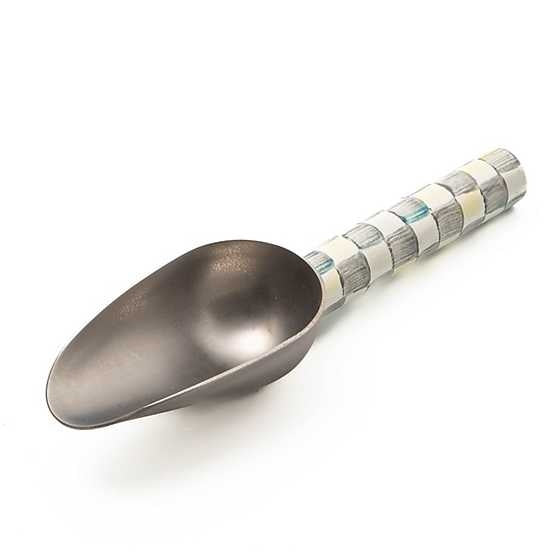 Small stainless steel scoop with hand-painted checkered enamel finish